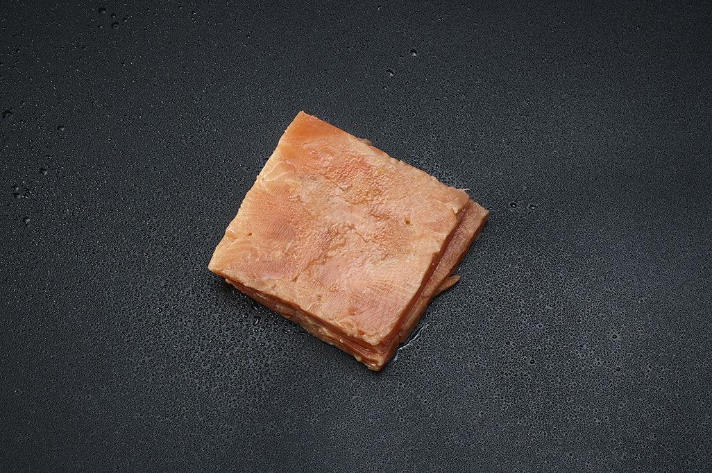CUBES CUT FROM FROZEN PINK SALMON FILLETS BLOCK